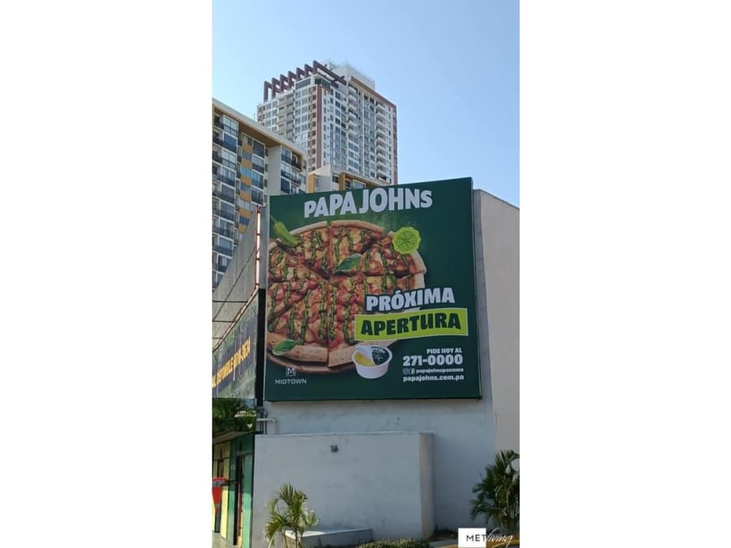 Exterior parking lot and storefronts with palm trees Midtown Plaza Tumba Muerto Panama