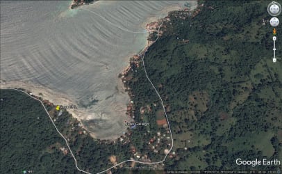 Panoramic view of beachfront property with palms, ocean, and Caribbean coastline in Panama