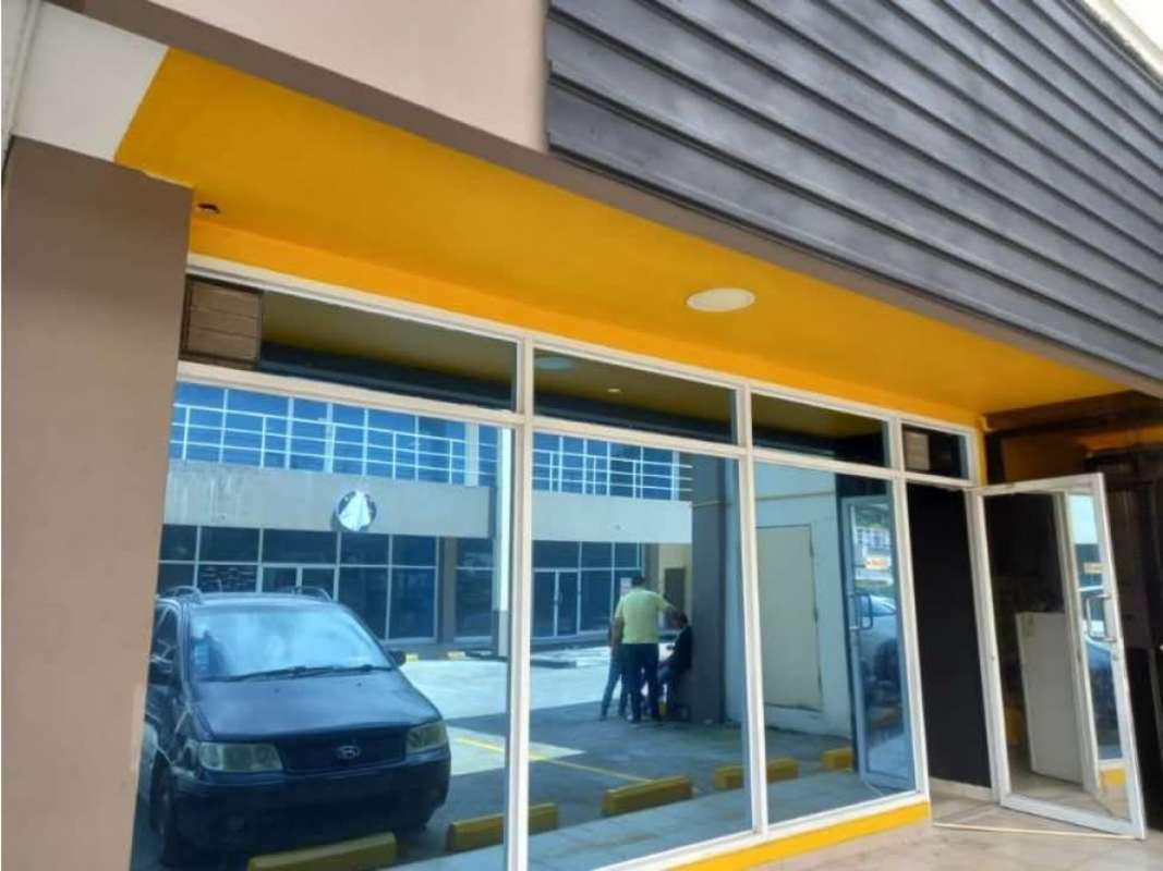 Commercial complex exterior with storefronts and parking Condado del Rey Panama City