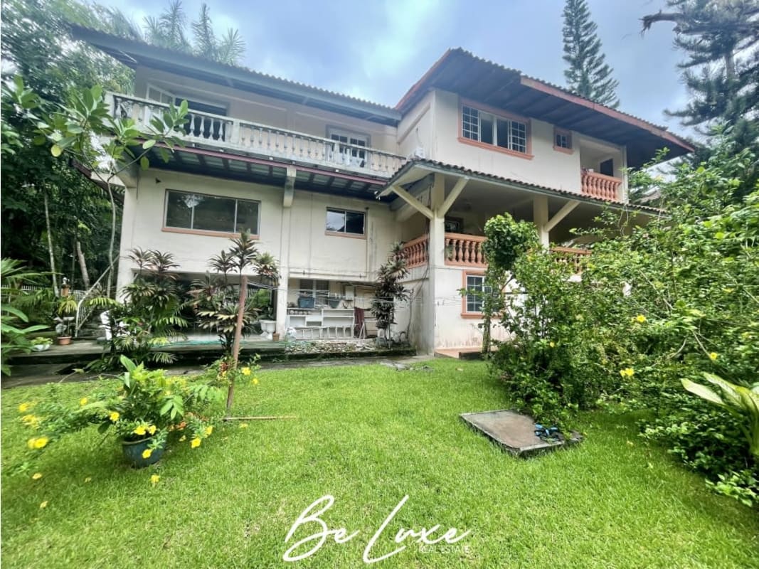 Private swimming pool surrounded by lush garden in duplex residential home Albrook Panama