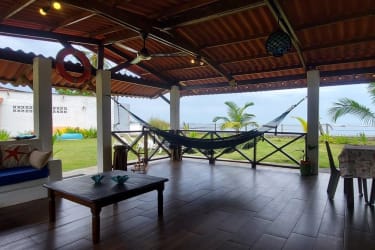 Beachfront terrace with hammocks and ocean view at Caribbean estate Colón Panama