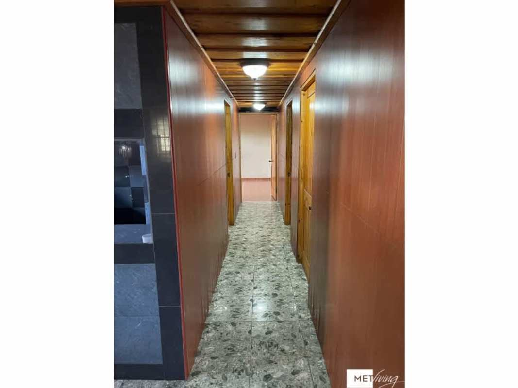 Kitchen featuring tiled counters, wood cabinetry, checkerboard backsplash and wood ceiling in Cerro Viento Panama City