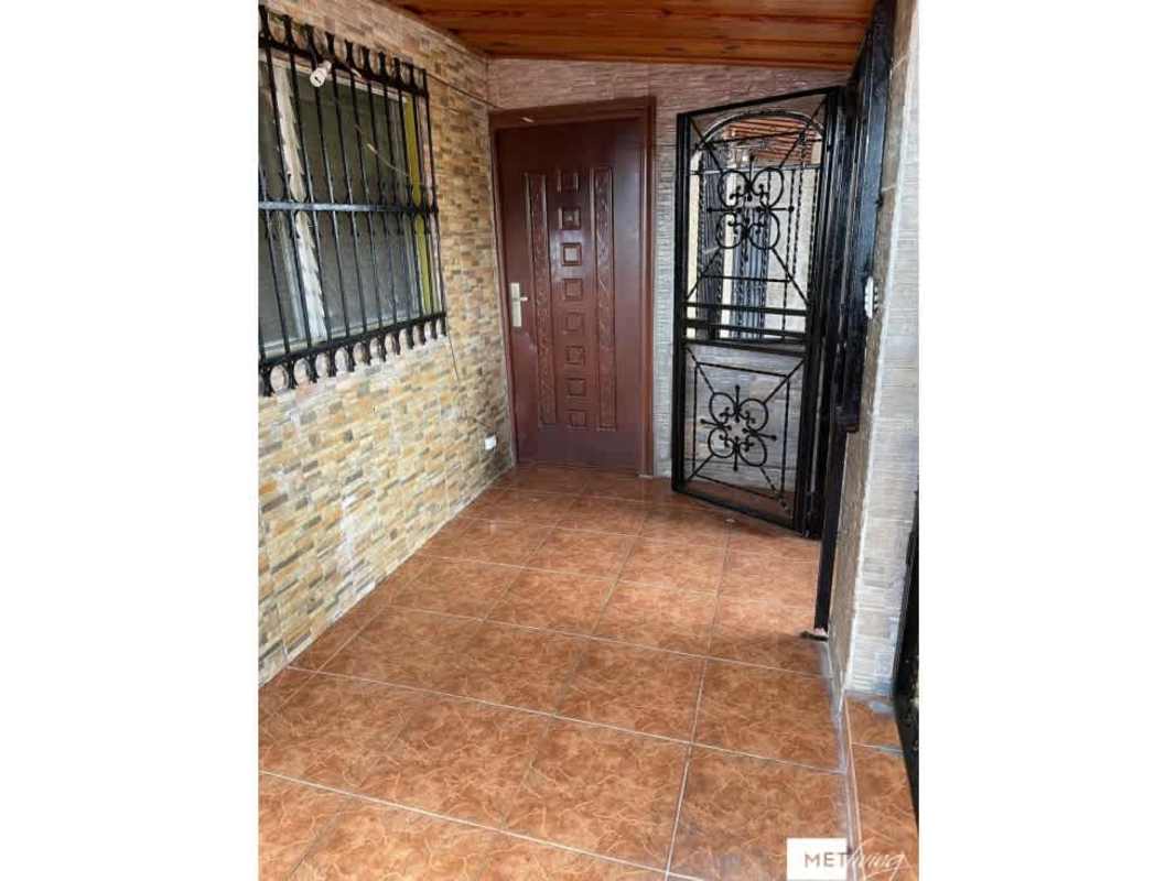 Covered entrance porch with metal security gate, window bars, tiled floor in house for sale Cerro Viento Panama City