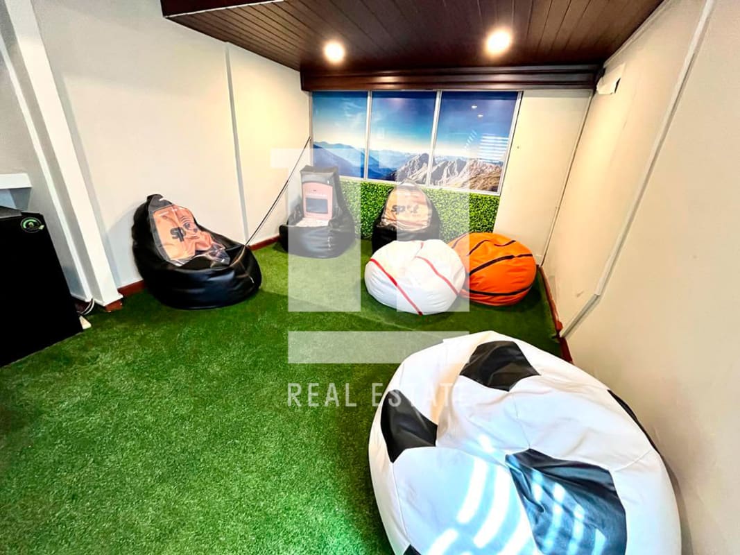 Entertainment/gaming area with turf flooring and sports bean bags Coco del Mar