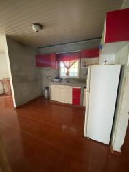 Small functional kitchen with cabinets and curtain window Penonomé Panama
