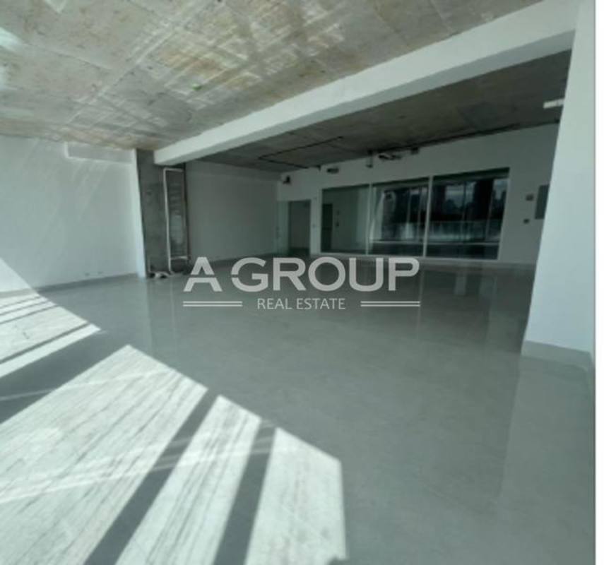 Lobby with marble finishes and security turnstiles at The Towers 50 commercial tower