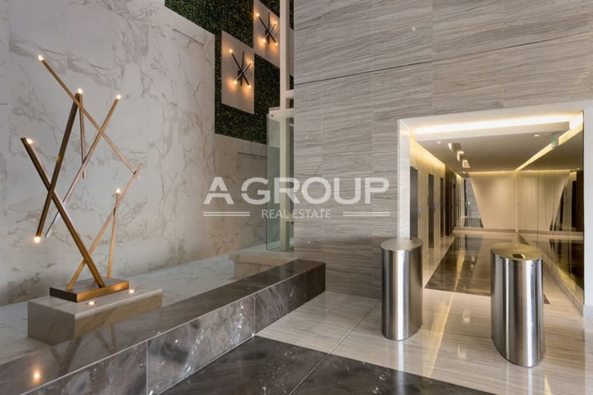 Lobby with marble, lighting features, and reception at The Towers 50 office building