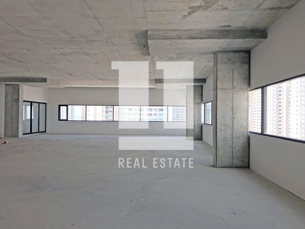 Interior open-plan commercial office shell with panoramic windows in PH Midtown Panama City