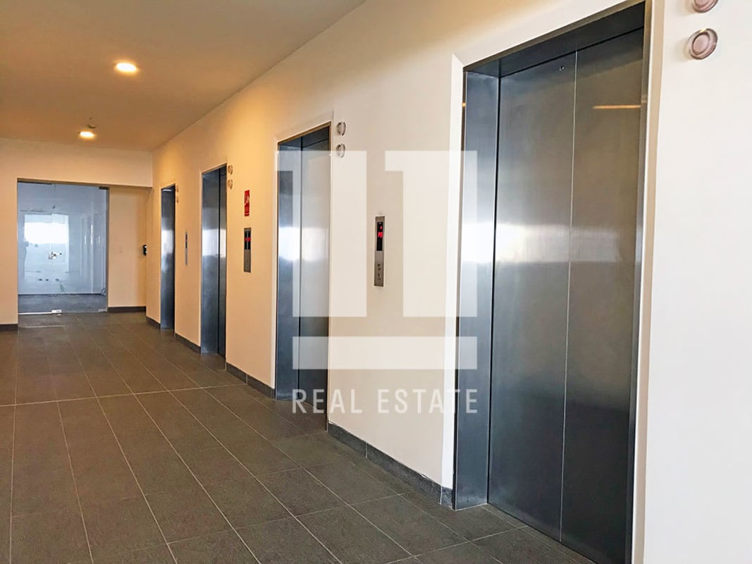 Modern corporate elevator lobby with stainless steel elevators in Midtown Tower San Francisco Panama