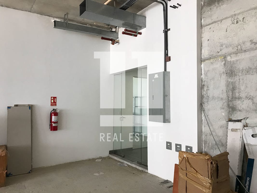 Unfinished commercial space with floor-to-ceiling windows city skyline Midtown Tower Panama