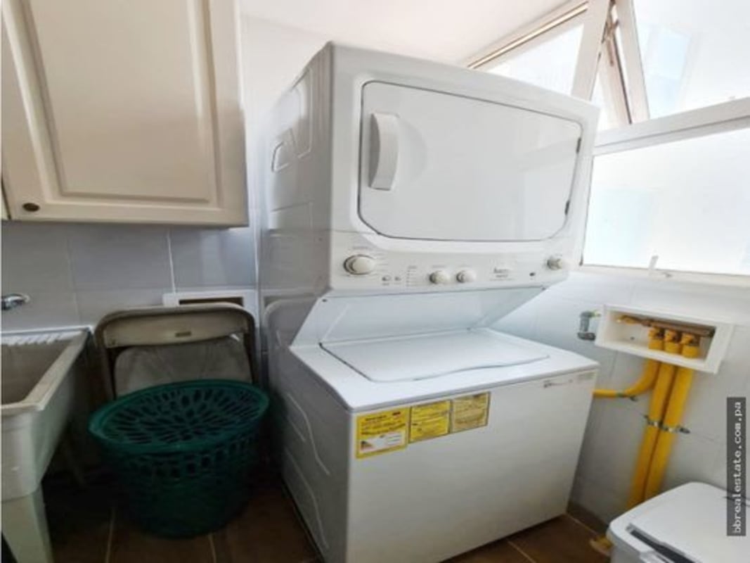 Kitchen with granite countertops, cabinets, gas stove at PH Sunrise Tower Obarrio Panama