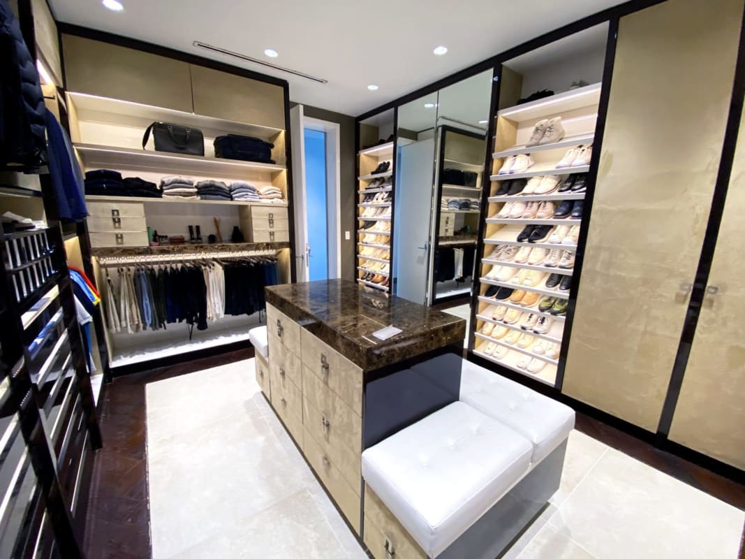 Luxurious boutique-style walk-in closet clad in Alcantara leather in Pacific Point penthouse Punta Pacifica