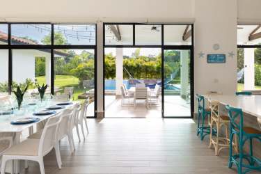 Spacious master bedroom with jacuzzi tub large windows in luxury Punta Barco beachfront villa Panama