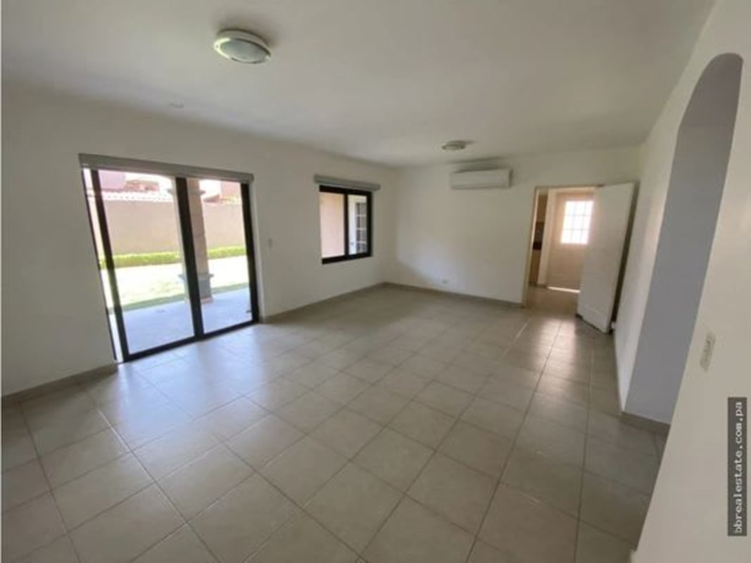 Bright open living room with tile floors, large windows in Versalles Costa Sur Panama