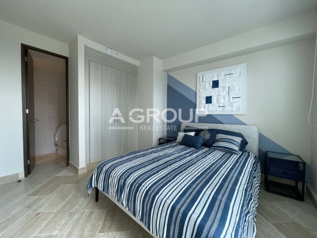 Elegant master bedroom with ensuite bathroom large window view in The Regent Costa del Este Panama