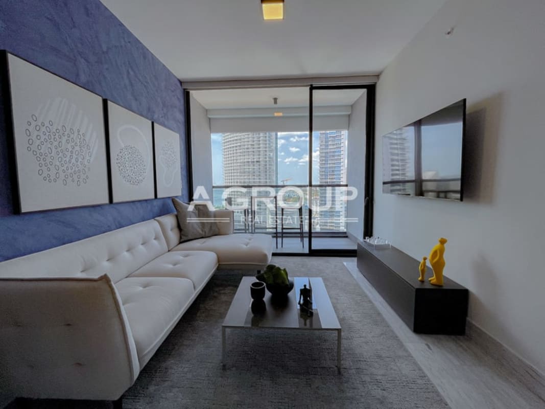 Modern kitchen with island, stainless steel appliances at Nuovo Armani Casa Panama City