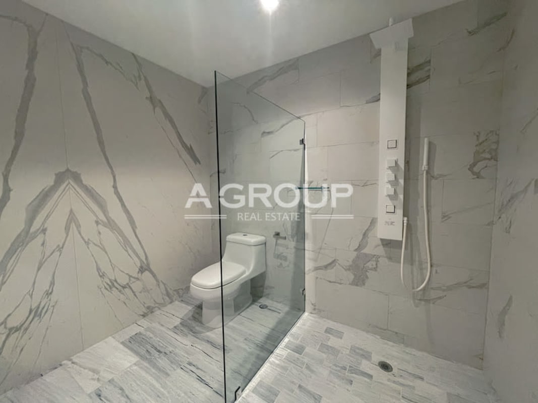 Modern bright living dining area with balcony access ocean views at Nuovo by Armani Panama