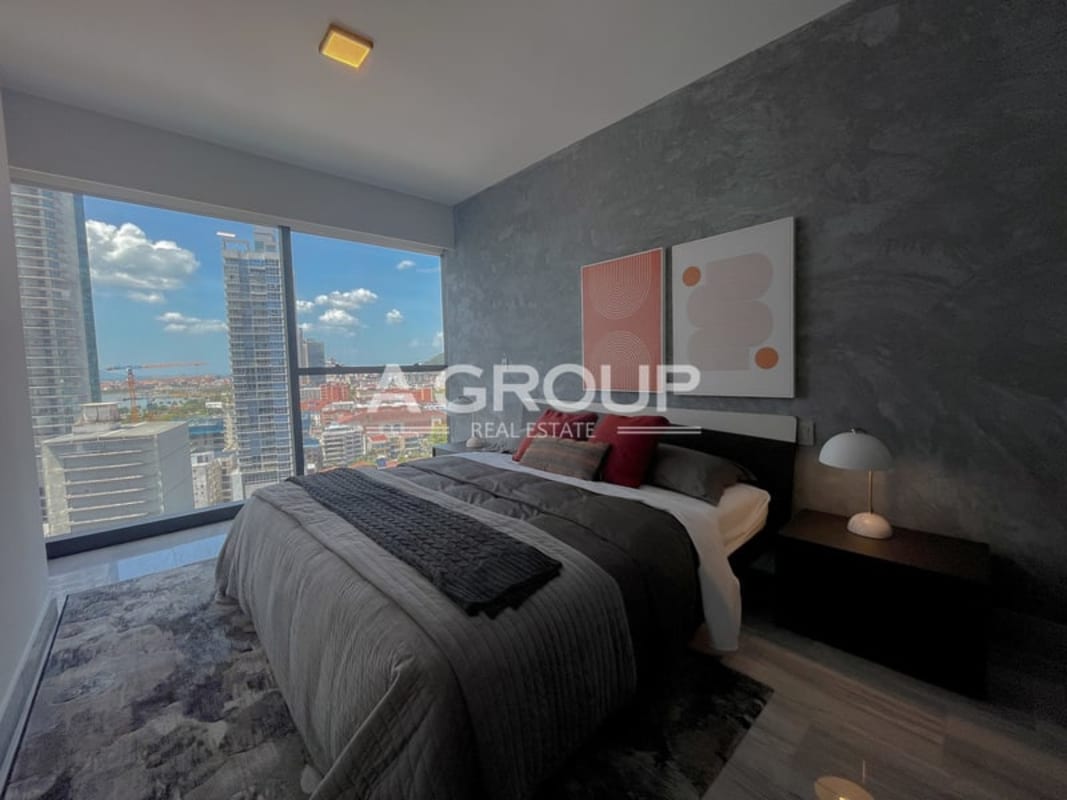 Rooftop infinity pool with ocean and city views at Nuovo by Armani Casa Panama City