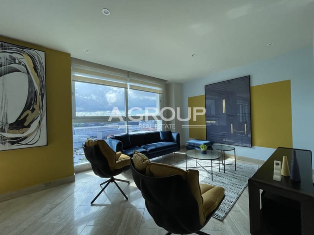 Spacious living room with large windows and city views at The Regent Costa del Este Panama