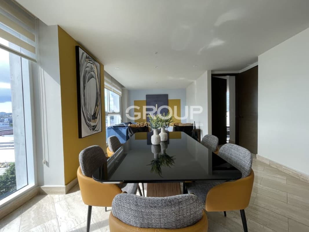 Master bedroom with ensuite, large windows and city skyline views at The Regent Costa del Este Panama