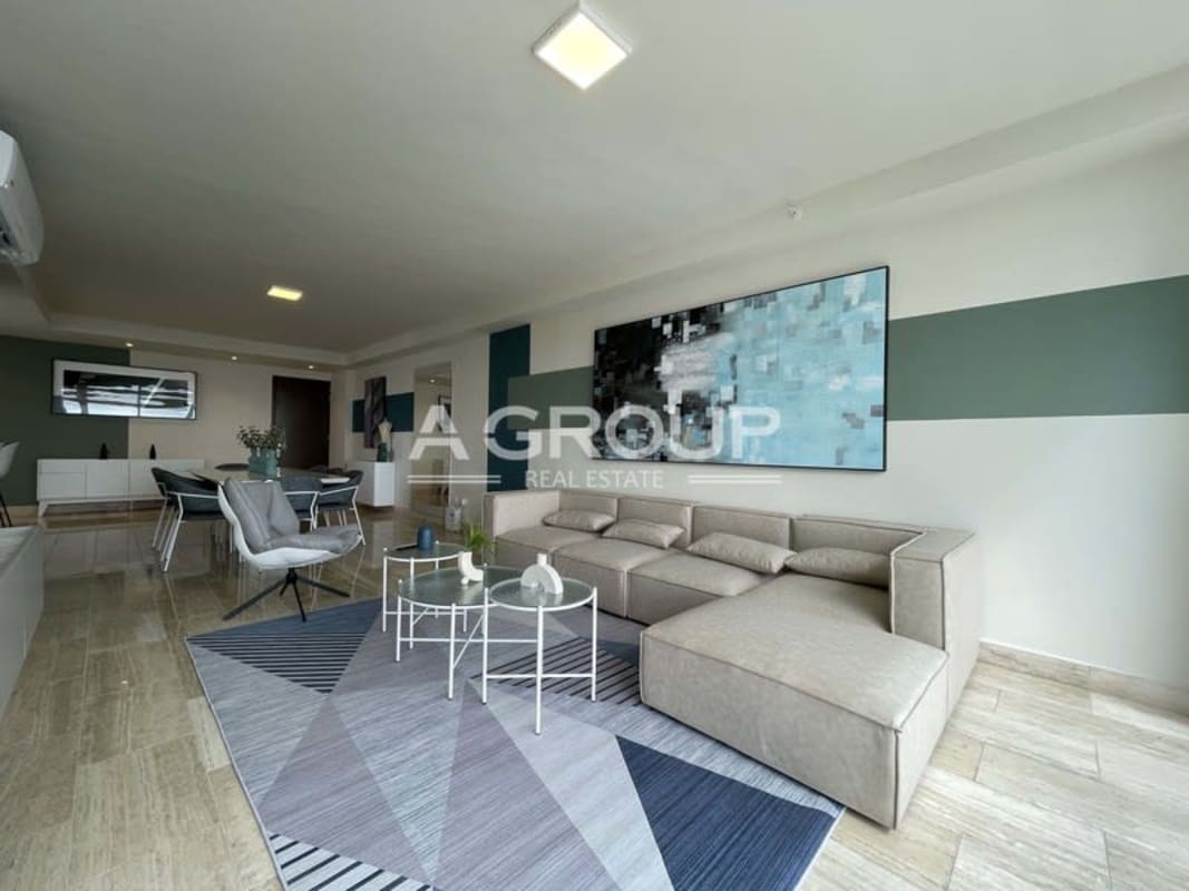 Modern open-concept living and dining room with marble flooring and large windows in PH The Regent Panama