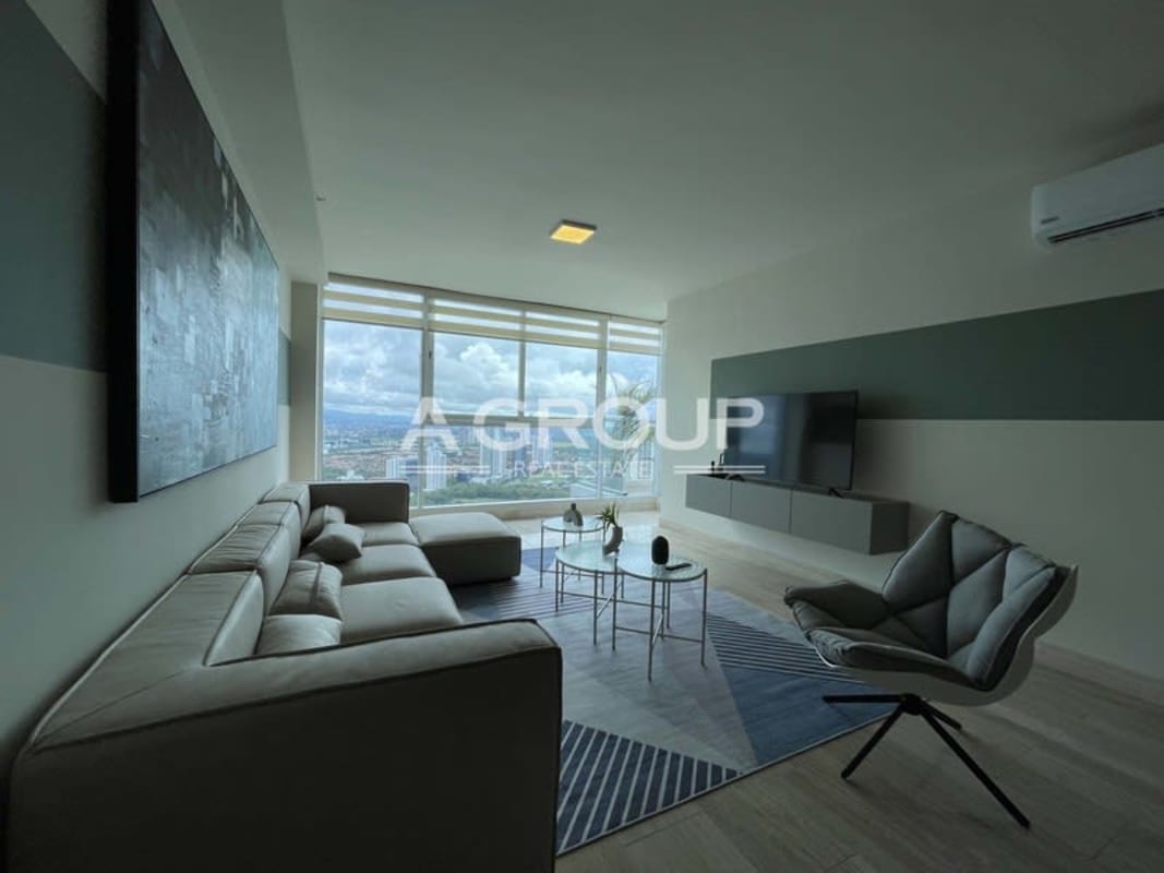 Contemporary living room with large sectional sofa, floor-to-ceiling windows and ocean view in Costa del Este