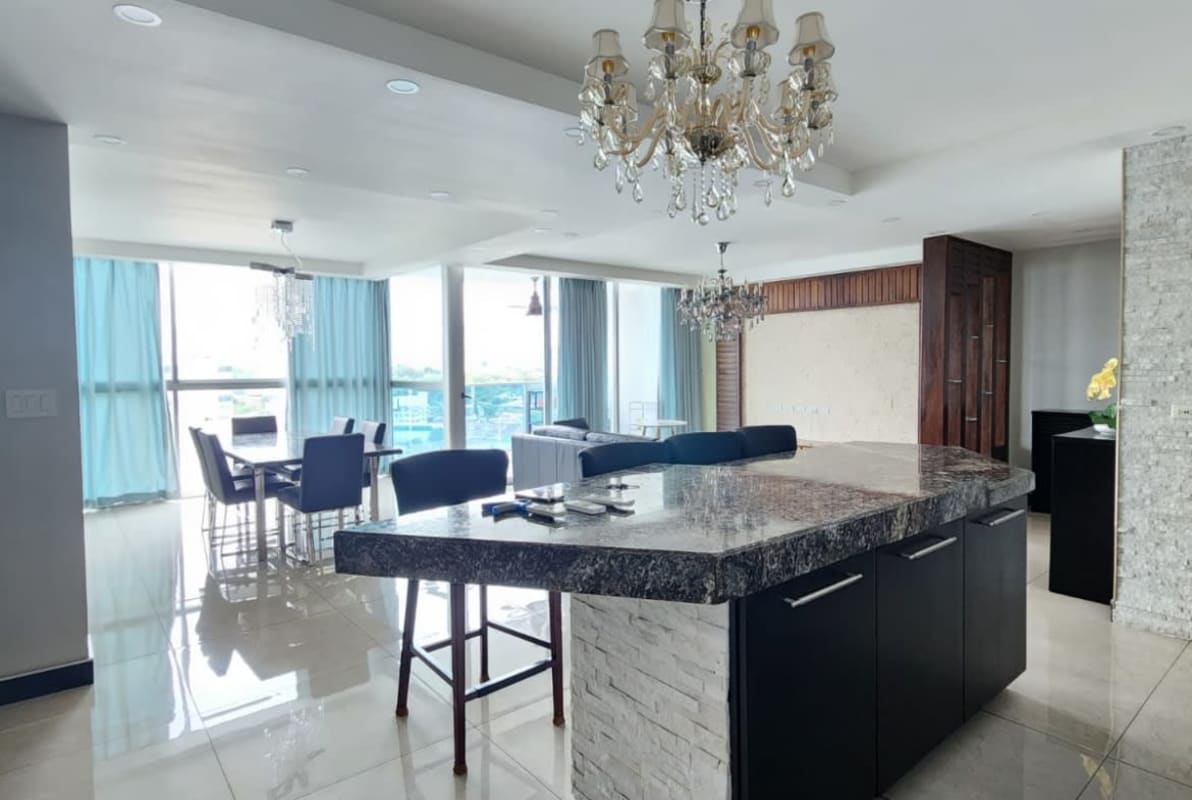 Modern gym with large mirrors, cardio and weight machines at PH Waterfalls Panama