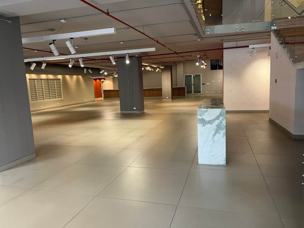 Spacious interior with marble counter, open floor plan, glass staircase in commercial unit Obarrio Panama City