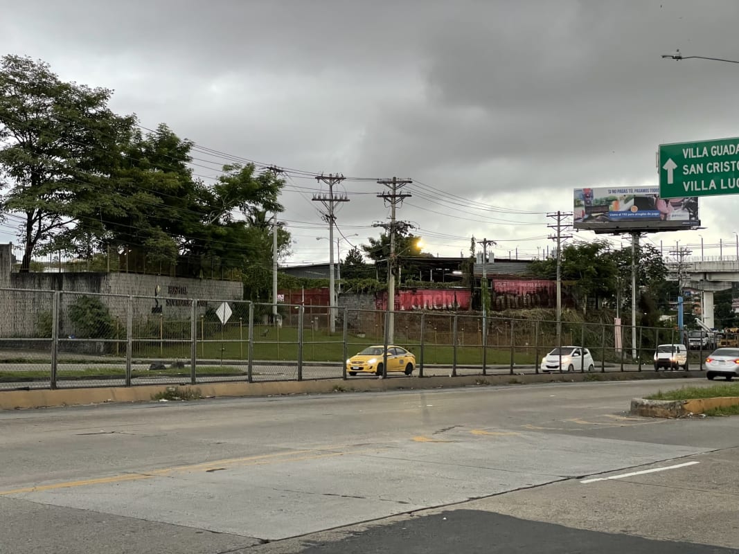 Corner of elevated highway major intersection with commercial lot Panama City