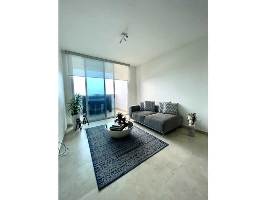 Modern living room with floor-to-ceiling windows and balcony ocean view in PH H2O on Avenida Balboa Panama City