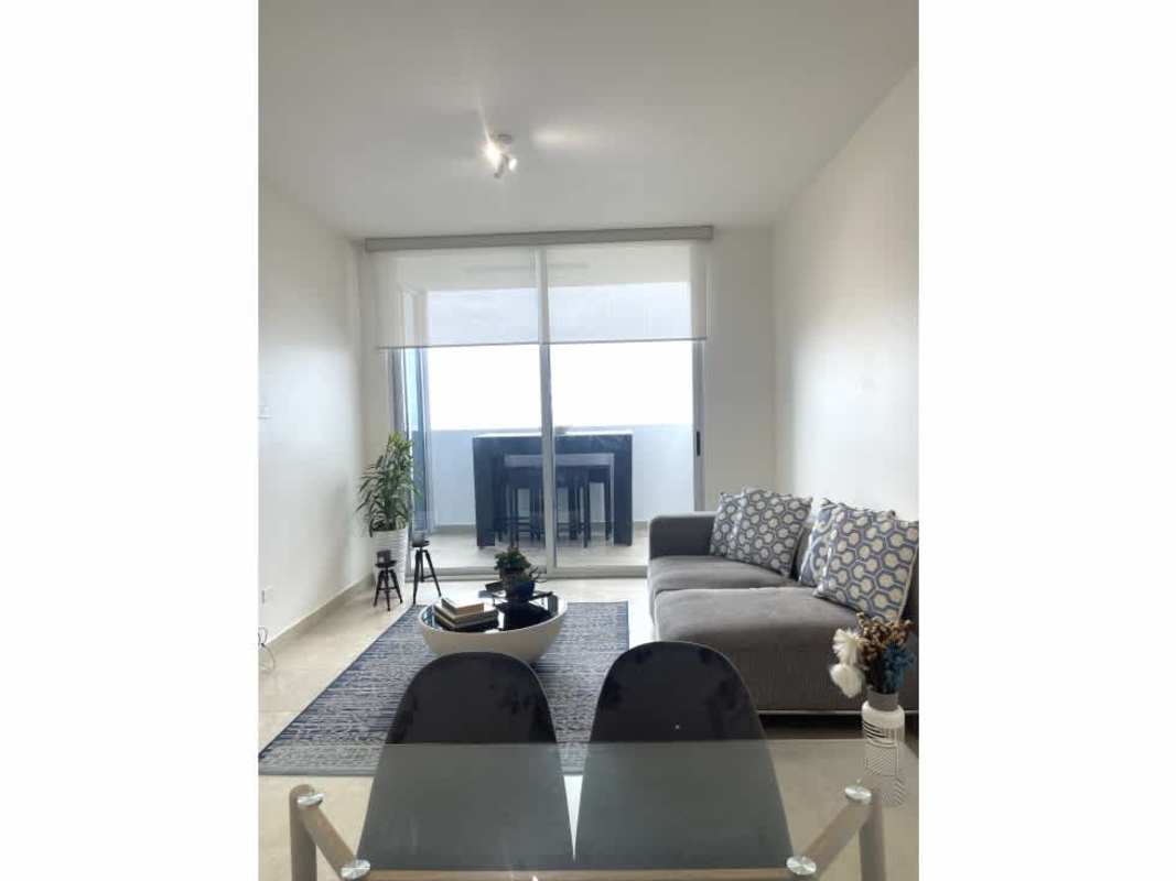 Modern open kitchen with bar and appliances in PH H2O on Avenida Balboa Panama City