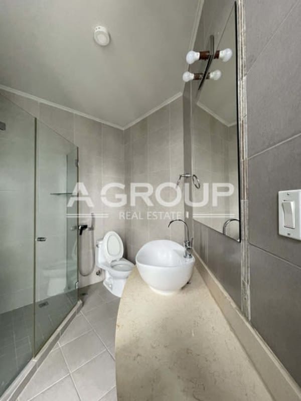 Large balcony overlooking city skyline and gardens in Country Club Costa del Este Panama