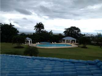 Lagoon pool with gazebos and green gardens inside Playa Blanca resort Panama