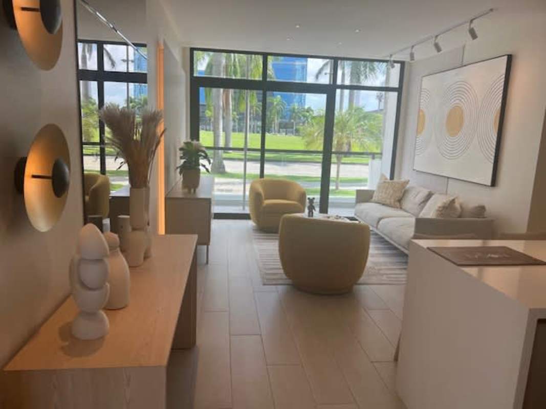 Bright living area with natural light, large windows, city views at PH Nogal Panama
