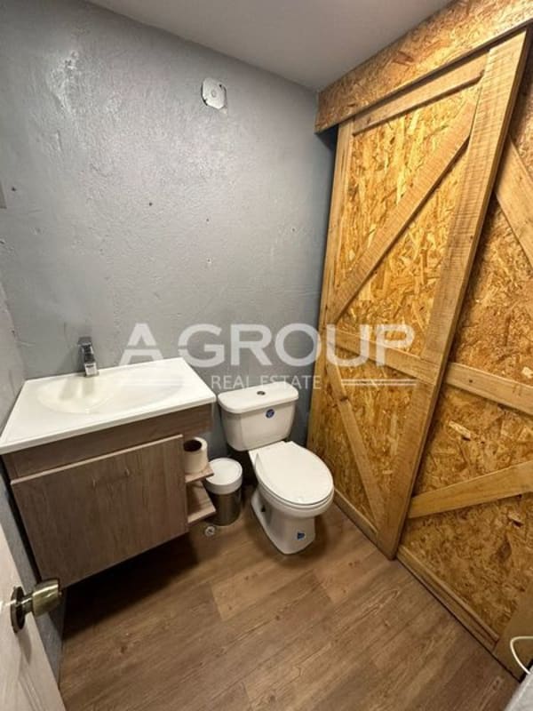 Glass storefront entrance of commercial rental space in modern plaza San Francisco Panama