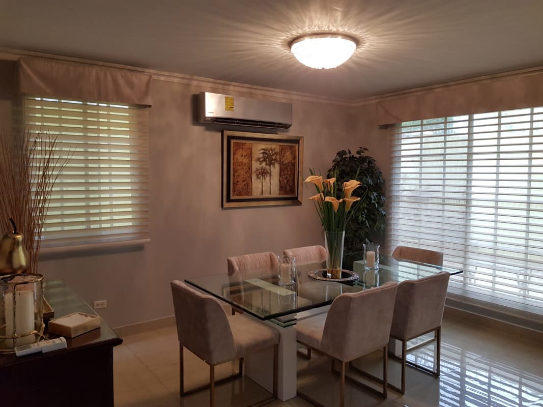 Modern dining room with large windows, glass table in Crystal Springs Condado del Rey Panama