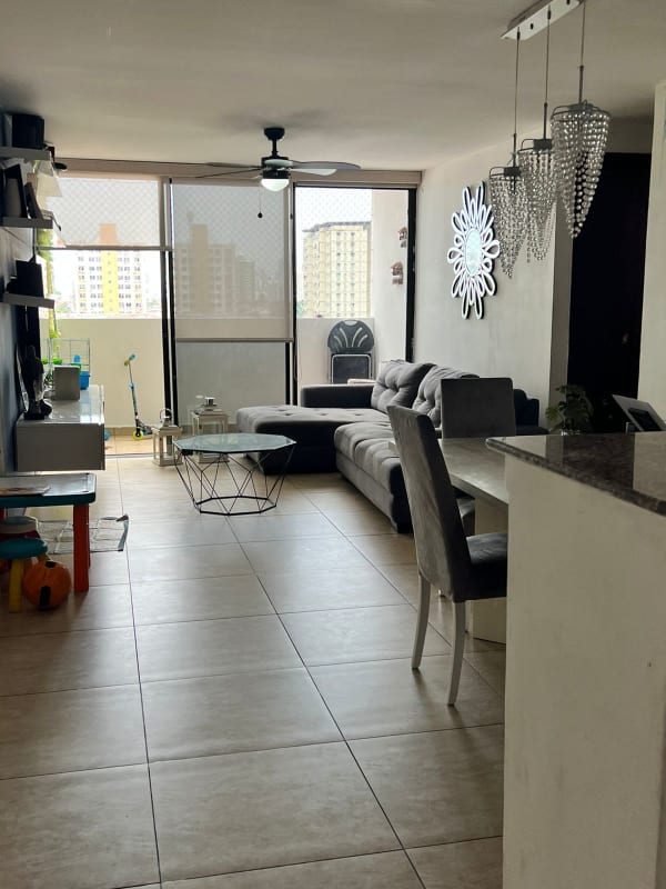 Open living dining space with windows and tile floors in Condado del Rey apartment Panama