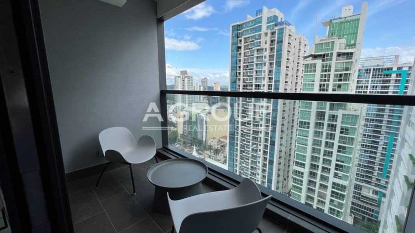 Designer furnished bedroom with textured accent wall large window Nuovo Armani Casa Panama