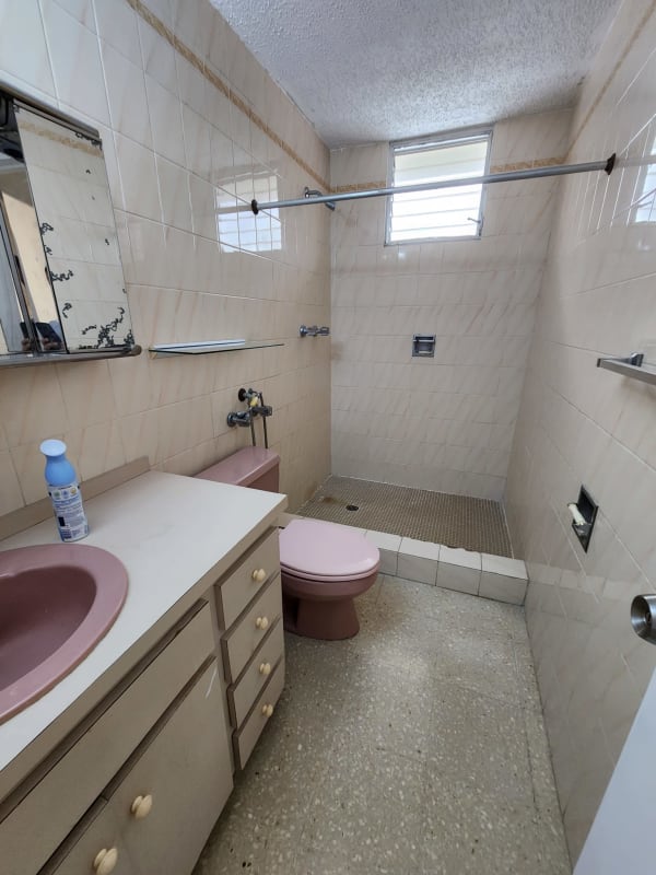 Bedroom with large window built-in wardrobe tile flooring PH La Alameda Panama