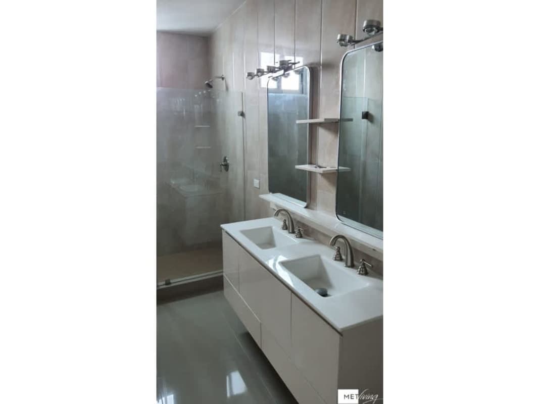 Outdoor lounge area next to pool at Top Tower Costa del Este Panama