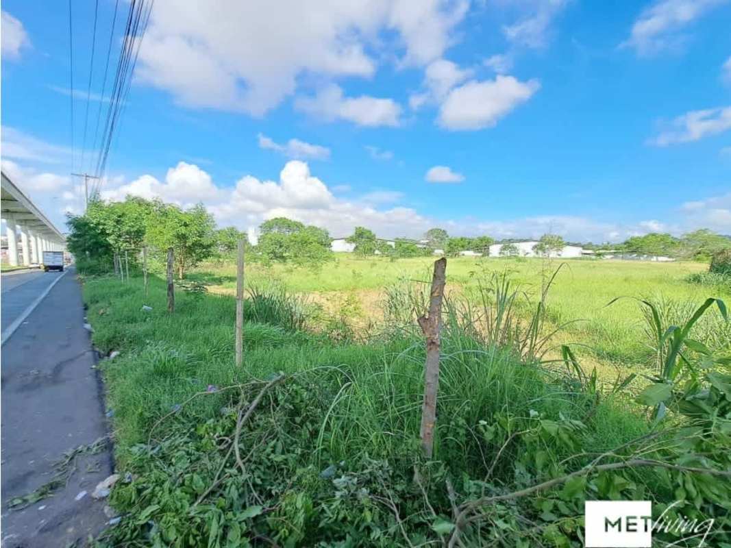 Expansive flat industrial commercial land near Tocumen Airport for sale at 24 de Diciembre, Panama City, with highway frontage
