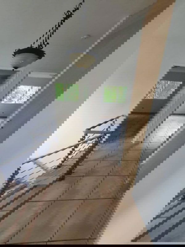 Hallway with tiled floors staircase and pendant light PH Everest Panama