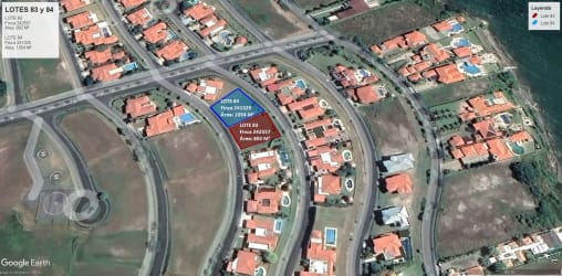 Aerial view of residential lots for sale in Vista Mar Golf Resort with red roof homes in coastal Panama