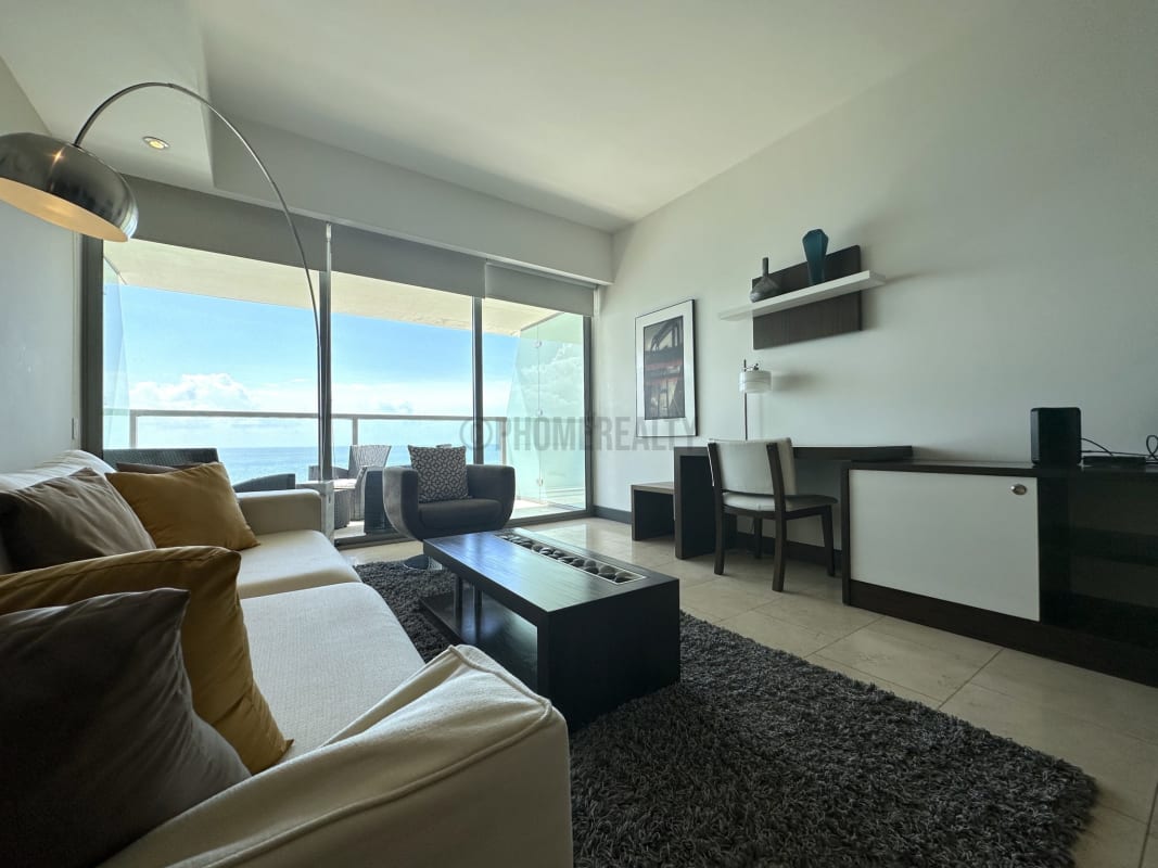 Compact Italian-style kitchen with granite countertop in luxury Punta Pacifica studio apartment