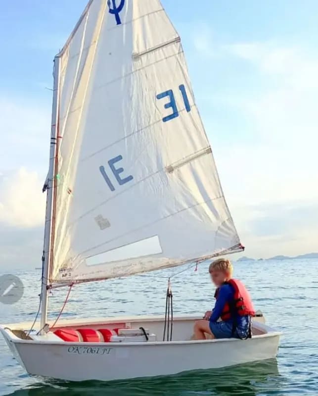 Young sailor in small boat on calm waters offshore Ocean Reef Panama
