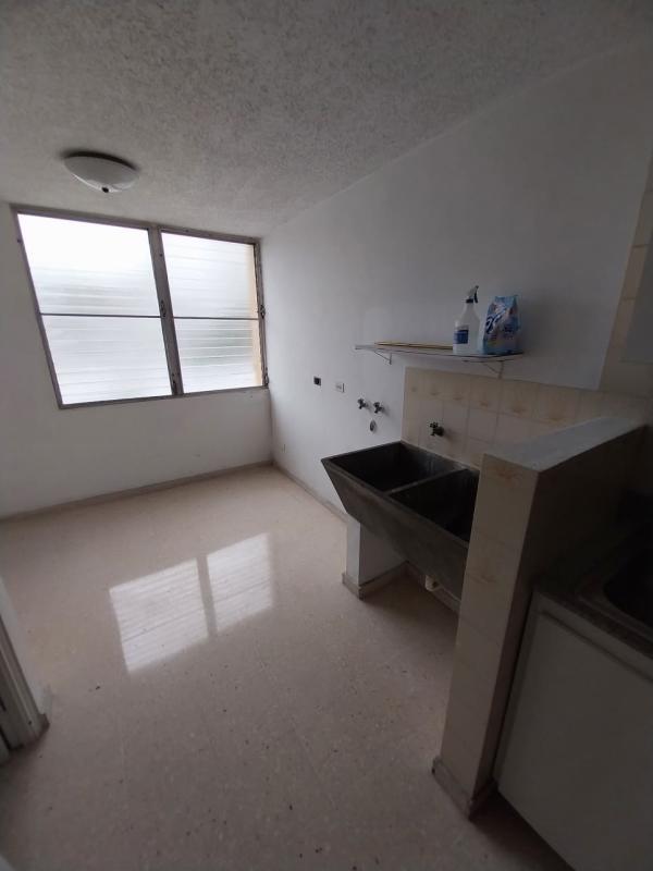 Functional kitchen with window and laundry access in PH La Alameda Panama City