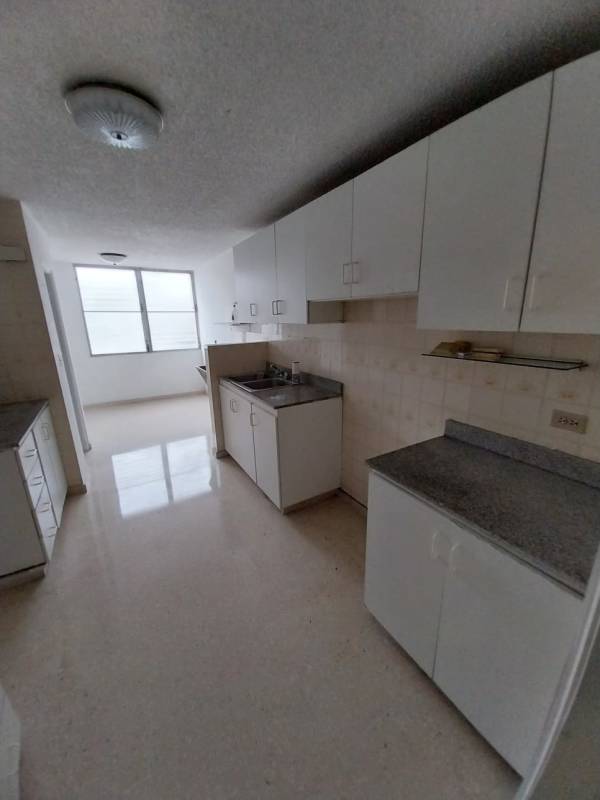 Outdoor resident swimming pool with garden views in La Alameda Panama City