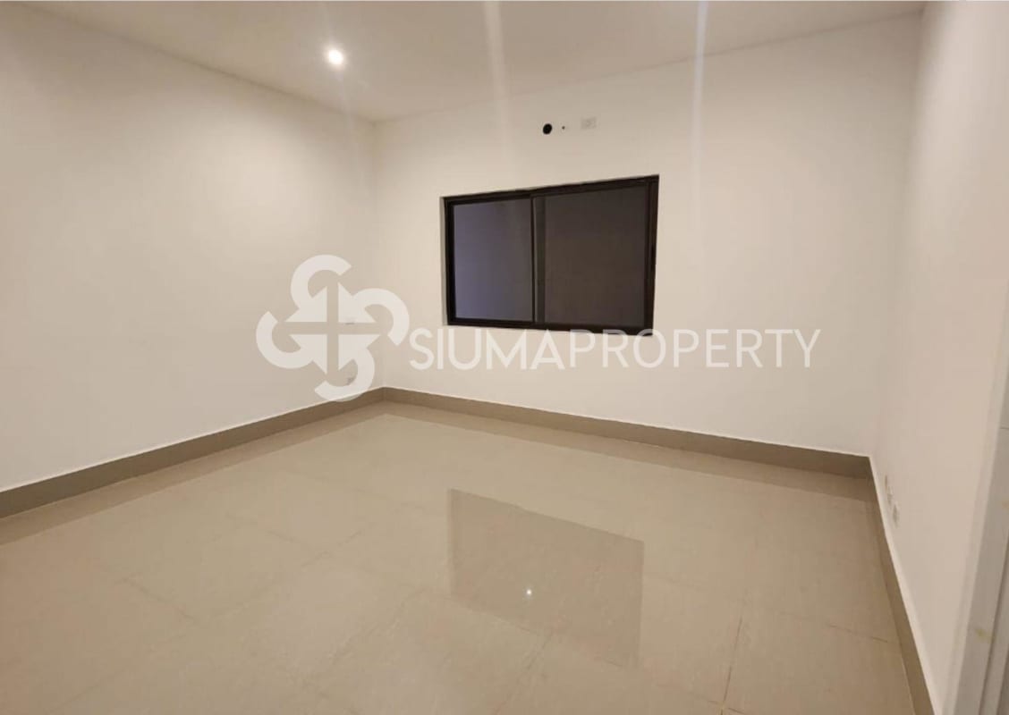 Empty modern bedroom with ceramic tile flooring and large window in two-story house Las Acacias Panama