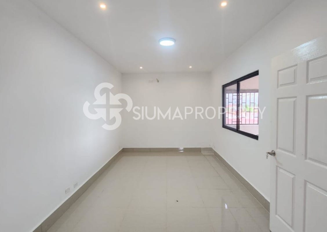 Modern minimalist bedroom with glossy floor large window and neutral decor Las Acacias Panama