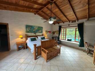 Large landscaped gardens stone terraces fruit trees mountain backdrop estate El Valle Panama